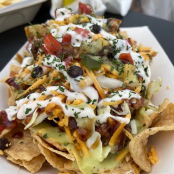 Black Leaf Vegan signature dishes Vegan Chili Cheese Fries, Mac and "Cheese," Bang Bang Shrimp, Loaded Nachos.
